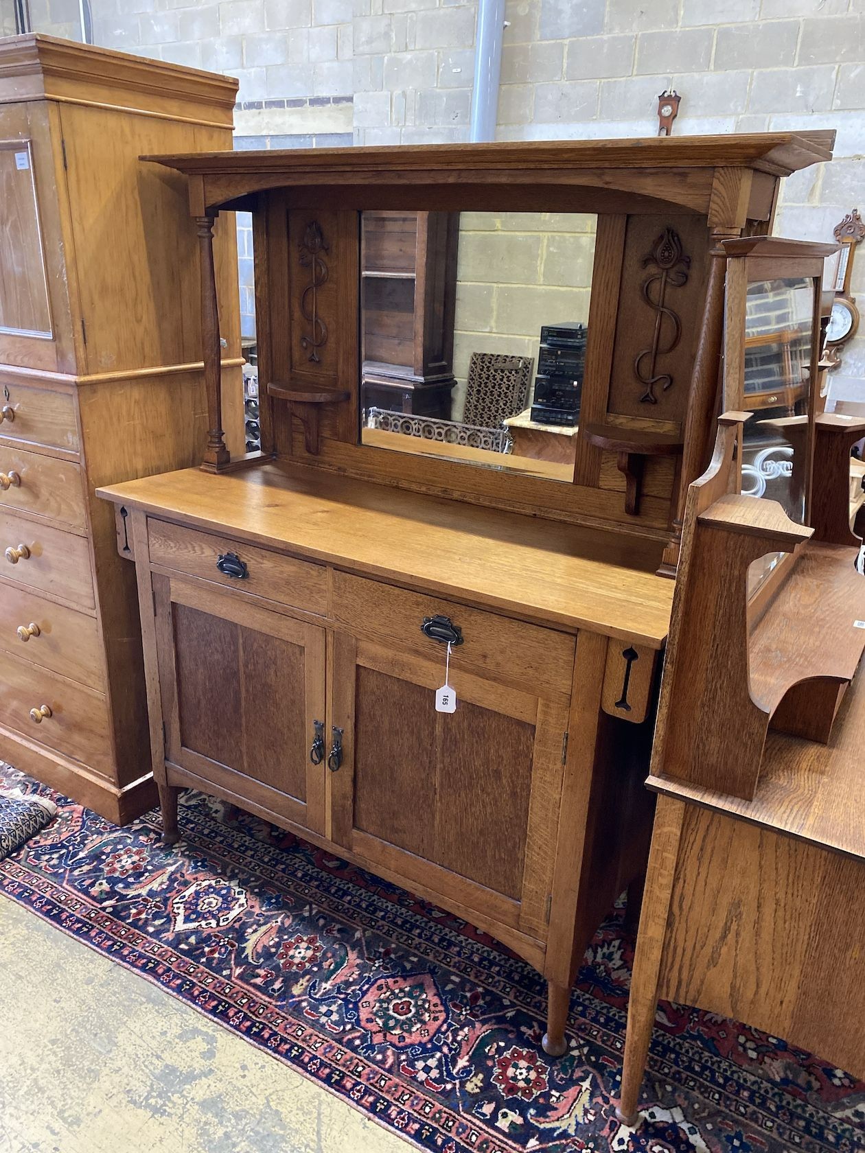 An early 20th century Art Nouveau oak mirrored back sideboard, length 137cm, width 52cm, height 172cm